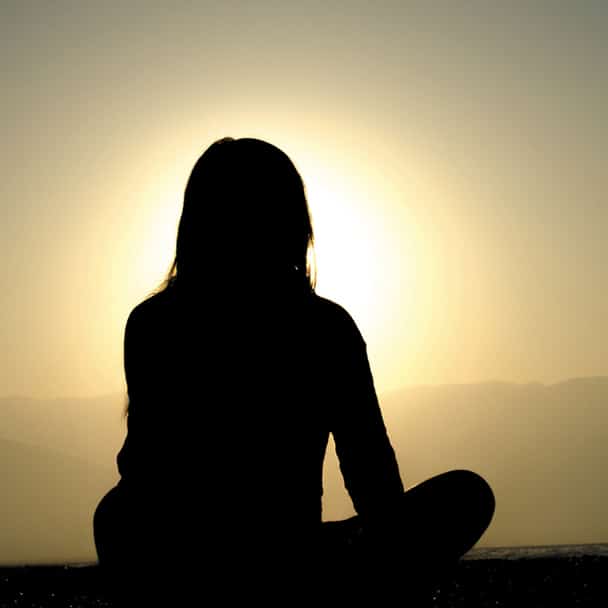 Teachings - Meditator with Sun - Photo by Dingzeyu Li