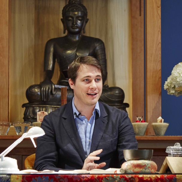 Trinlay Rinpoche teaching with Buddha Statue